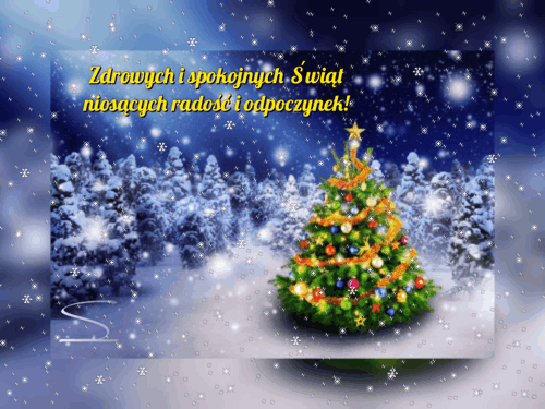 O�nie�ona choinka w zimowym lesie, padaj�cy �nieg i napis Zdrowych i spokojnych �wi�t