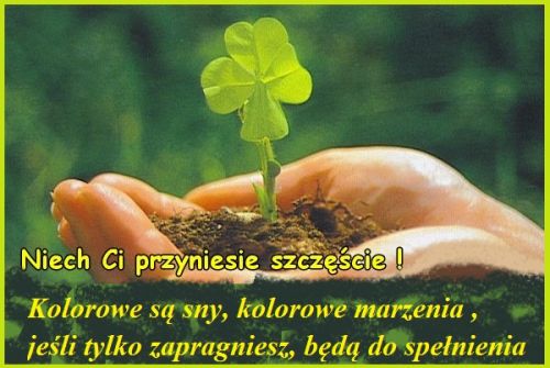 D�o� trzymaj�ca ziemi� z czterolistn� koniczyn� i �yczenia szcz�cia oraz spe�nienia marze�