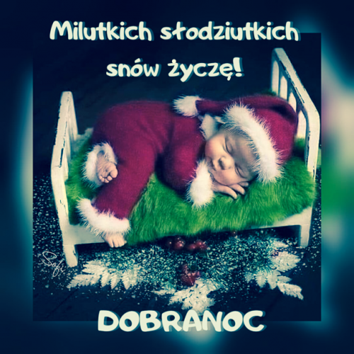 �pi�cy niemowlak w stroju Miko�aja le�y w bia�ym ��eczku z napisem Dobranoc