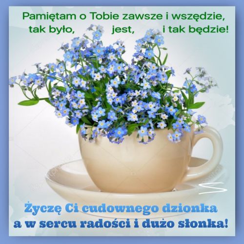 Be�owa fili�anka z niebieskimi niezapominajkami na spodku z napisem �ycz�cym mi�ego dnia